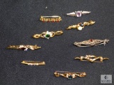 Assorted costume bar pins