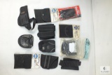 Assortment of holsters and cases