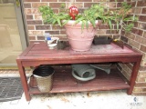 Wood outdoor planting table with Contents Flower pot, and watering jug