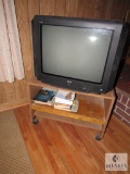 Small Cart with RCA Television and lot of books