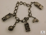 Sterling Silver Charm Bracelet w/ assorted Charms marked Silver