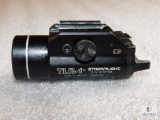 Streamlight TLR-1 tactical light that mounts to rail of firearm