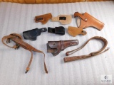 Assortment of leather holsters and accessories