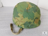 Military Metal Combat Helmet with Camo Cloth Cover.