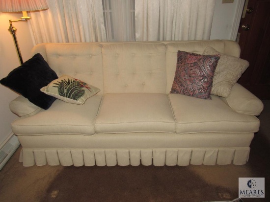 Cream Colored Sofa with Throw Pillows
