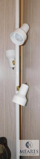White Adjustable Floor-to-Ceiling Lamp.