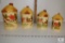 Vintage, retro ceramic canister set with orange thatched roof lid, cows, barns / farm scene canister