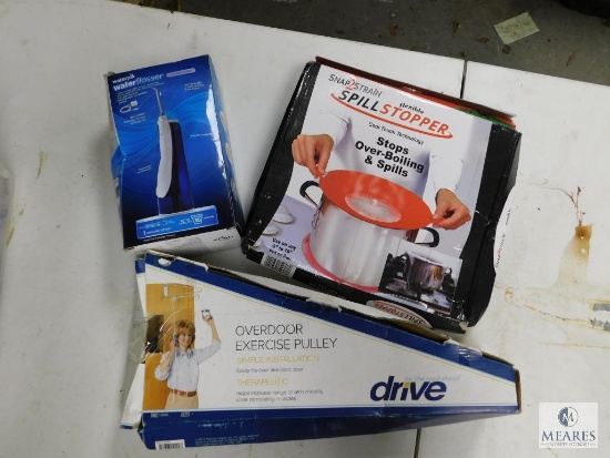 Lot Waterpik Flosser, Spill Stopper, & Overdoor Exercise Pulley