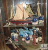 Shelf Lot of Lighthouse and Boat Captain Decorations Figurines, Candle Holders, Vases, and Plate