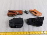 Lot of 4 Assorted Handgun Holsters Fobus paddle style, 2) Leather, and 1 Nylon