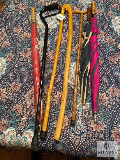 Lot of Four Canes and Three Golf Umbrellas