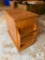 Wooden side table with magazine rack and end-opening door