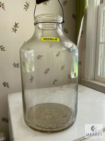 Glass jug with wire handle