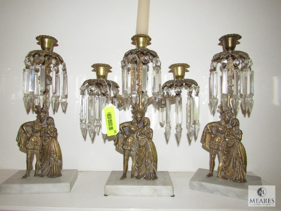 A three-piece Lot of Victorian Brass Candle Holders with Marble Bases and Hanging Crystals