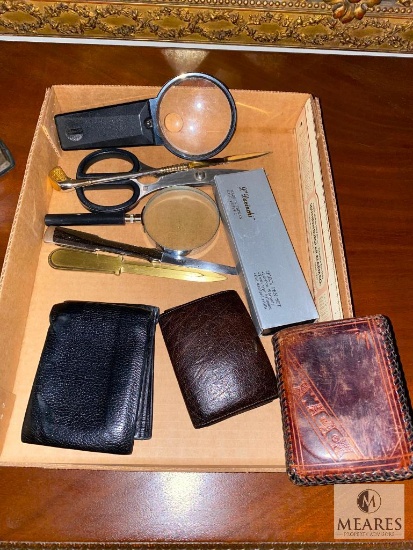 Lot of assorted men's wallets, magnifiers and other desk items