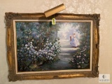 Framed and lighted oil painting of a lady waiting in the garden