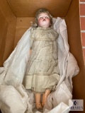 Doll with plastic arms, head and legs - rolling eyes