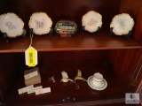 Contents of the china cabinet including porcelain vases, teacups, saucers, bowls