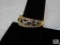 Ladies Costume Ring size 9 gold tone band with clear rhinestones