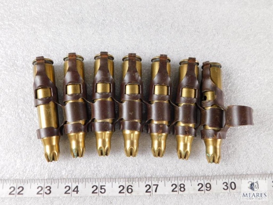 7 Rounds .50 Caliber Blanks on Belt Link