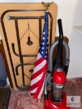 Four-foot Folding Table, American Flag and Vacuum with Shelf Contents
