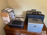 Contents on Top of Writing Desk - Shredder, Printer, Cases