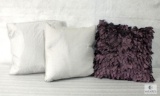 Lot of Three Decorative Pillows: Two Silver Down Pillows and One Purple