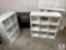 Three White Storage Shelves and One Black Entertainment Stand