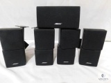 Four Bose Double Cube and One Bose Center Channel Wall Mount Speakers