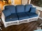 Wicker Sofa with Blue and White Pattern Cushions