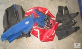 Assorted Scuba Gear Including Fins, Shirts, and Regulator Hose