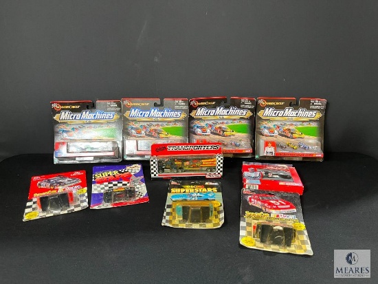 Collection of Matchbox Racing Cars Transporters and Playing Cards in Tin