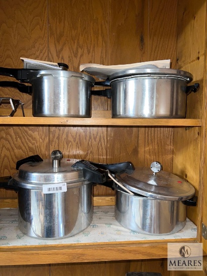 Group of Four Stainless Steel Pressure Cookers