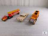 Two Small Tractor Trailer Trucks and One Toy Car