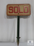 Two Sided Metal Sold Sign on a Metal Post