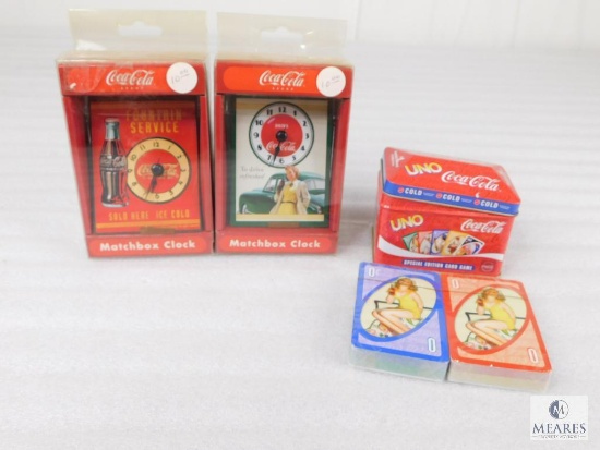 Two Coca-Cola Matchbox Cars and One Set Of Uno Cards in Tin Box