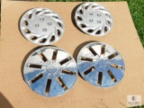 Group of Four Hubcaps