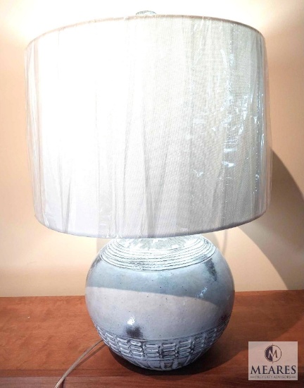 The Natural Light Amuleto Pottery Orb Table Lamp with Beige Drum Shade