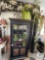 Bookcase and Contents with Green Dishes, Cornice Board and Floral Bucket