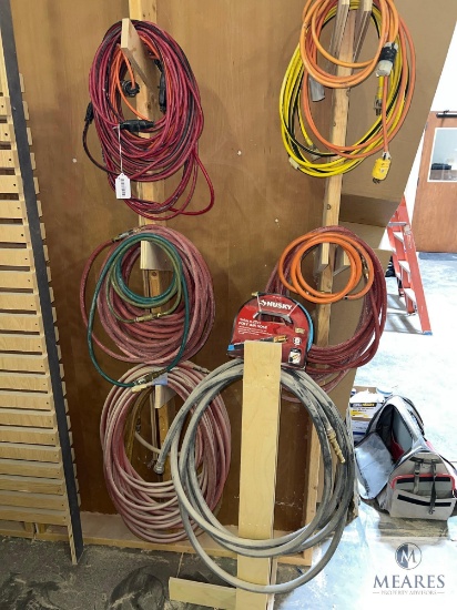 Group of Power Cords and Air Hoses