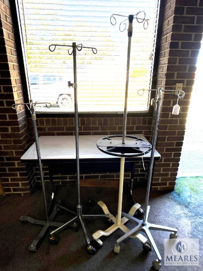 Group of Four Rolling IV Poles