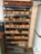 Industrial Metal Shelving Unit with Assorted Parts and Car Jack