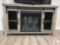 Rustic Fireplace Media Console with Mesh Cabinet Doors (Located in the Basement)