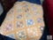 Vintage Patchwork Quilt with Soft Peach and Earth-Tone Patterns