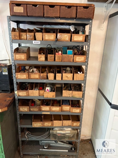 Industrial Metal Shelving Unit with Assorted Parts and Car Jack
