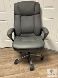 Grey High-Back Rolling Office Chair with Armrests (Located in the Basement)
