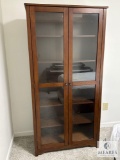 Wooden Glass-Front Display Cabinet with Shelving (Located in the Basement)