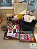 Diverse Assortment of Maps, Electronics, Travel Gear, and Collectibles