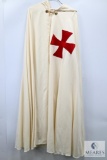 White Ceremonial Cloak with Red Cross Emblem and Ornate Gold Clasp