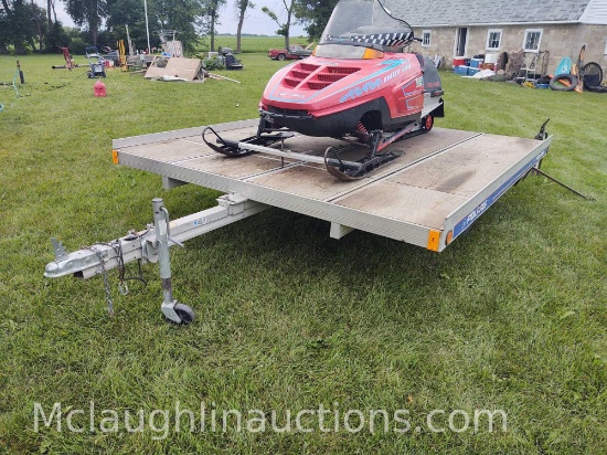 Polaris two place snowmobile trailer. Trailer measures 8 ft 4 in wide by 10 ft long. Snowmobile in